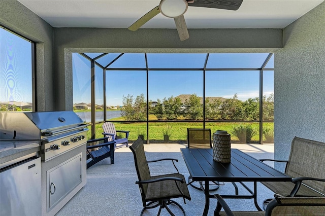 sunroom / solarium featuring ceiling fan and a wealth of natural light