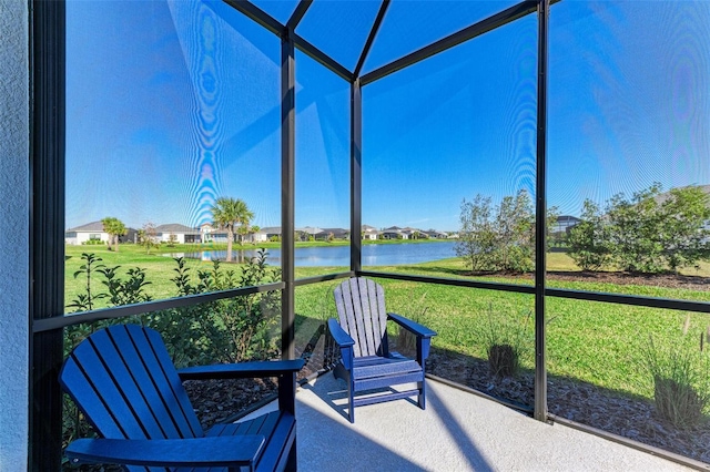 sunroom with a water view