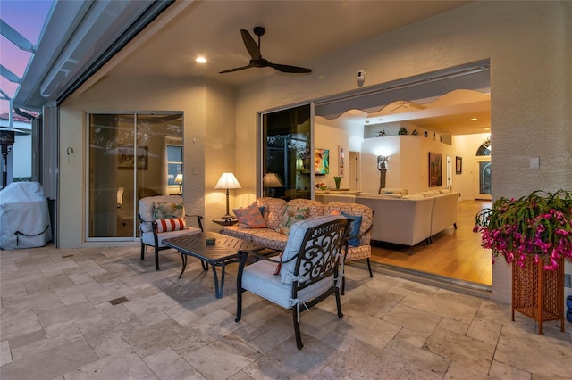 view of patio with outdoor lounge area, ceiling fan, and grilling area