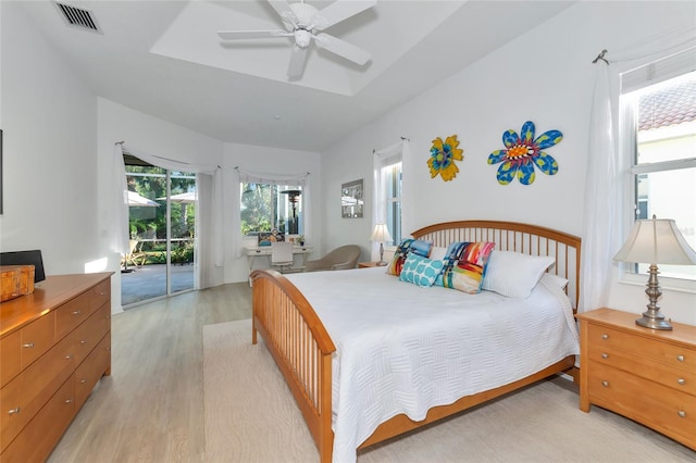 bedroom with ceiling fan, light wood-type flooring, and access to outside