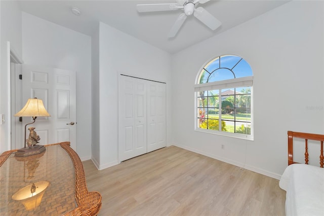 bedroom with ceiling fan, a closet, and light wood-type flooring