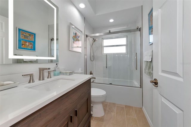 full bathroom with toilet, combined bath / shower with glass door, and vanity