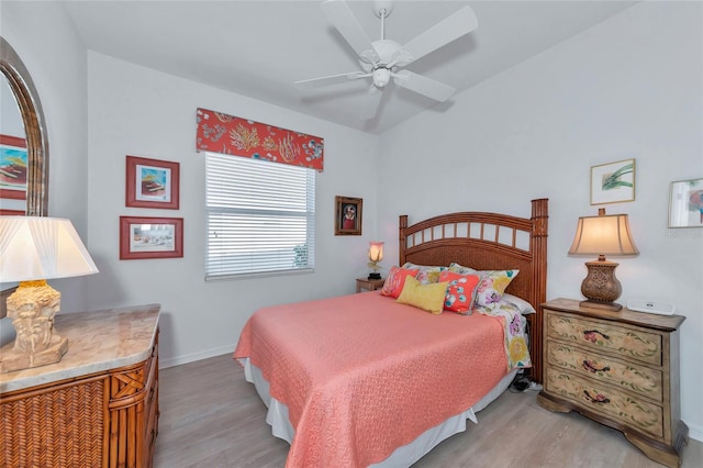 bedroom featuring light wood-type flooring and ceiling fan