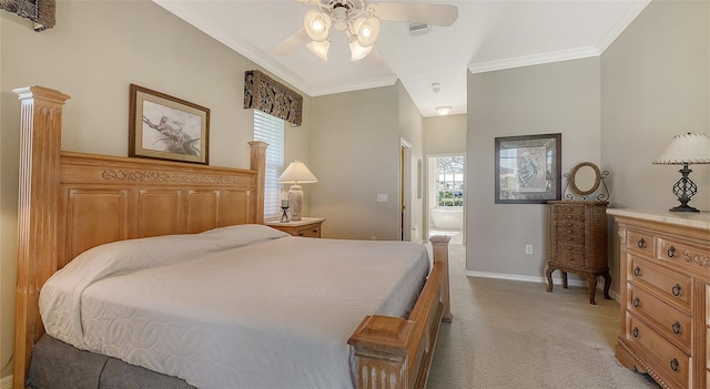 bedroom featuring ceiling fan, light colored carpet, ornamental molding, and ensuite bath