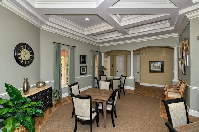 dining space featuring hardwood / wood-style flooring, crown molding, decorative columns, coffered ceiling, and beamed ceiling