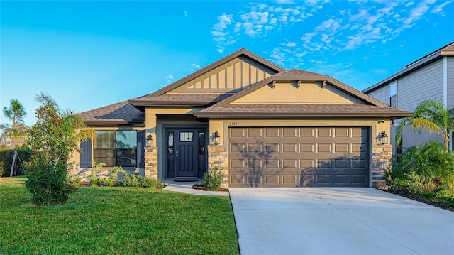 view of front of home with a garage and a front yard