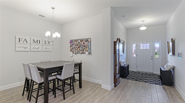 dining area featuring a chandelier