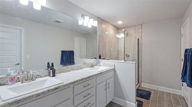 bathroom featuring vanity and a shower with shower door