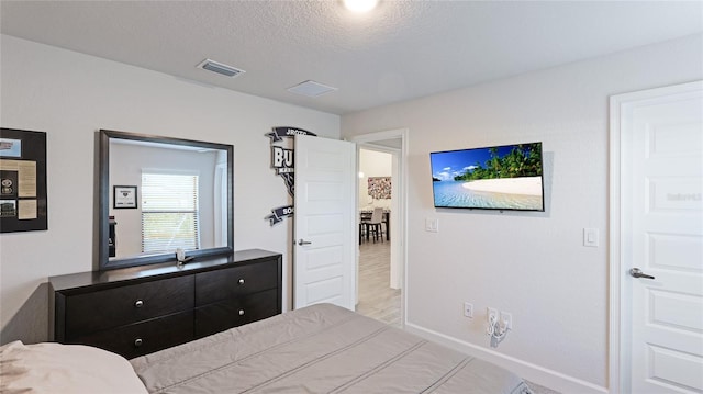 bedroom featuring a textured ceiling