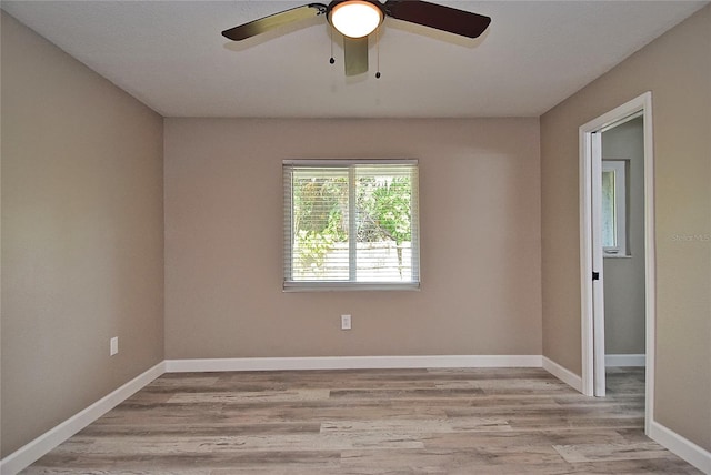 unfurnished room with ceiling fan and light wood-type flooring