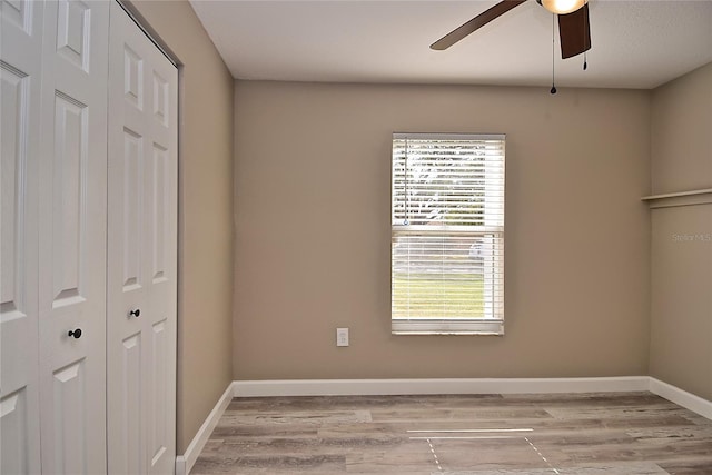 interior space with ceiling fan and light hardwood / wood-style floors