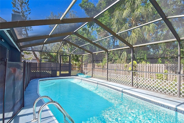 view of pool with a lanai