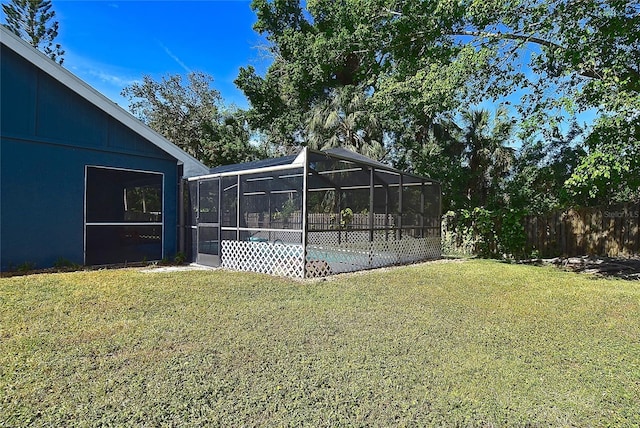 view of yard featuring glass enclosure