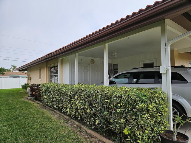 view of home's exterior with a lawn