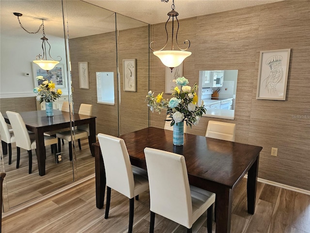 dining room with hardwood / wood-style floors