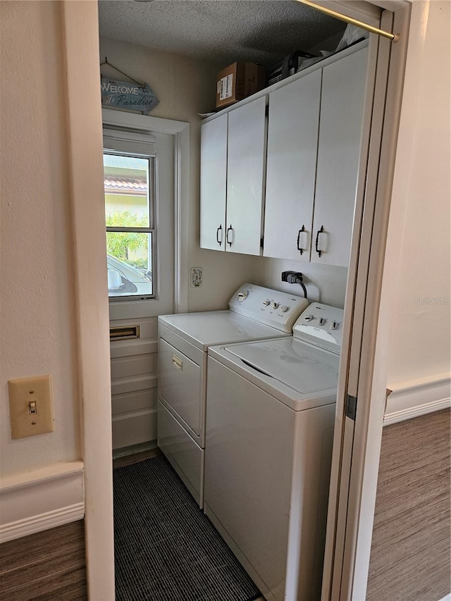 laundry room featuring cabinets and independent washer and dryer