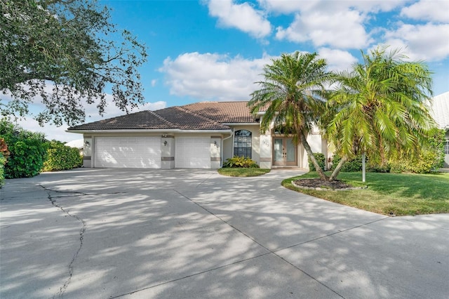 view of front facade with a garage and a front yard