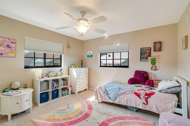 carpeted bedroom with ceiling fan