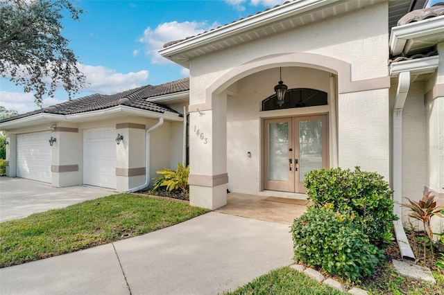 doorway to property with french doors and a garage