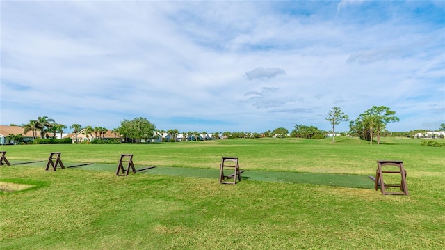 view of property's community featuring a yard