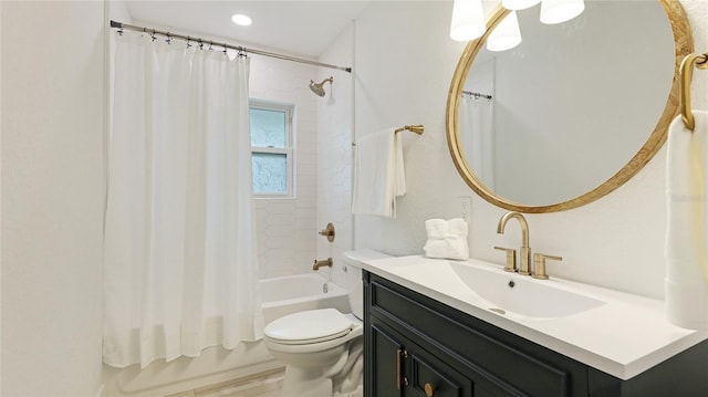 bathroom featuring shower / tub combo, toilet, and vanity