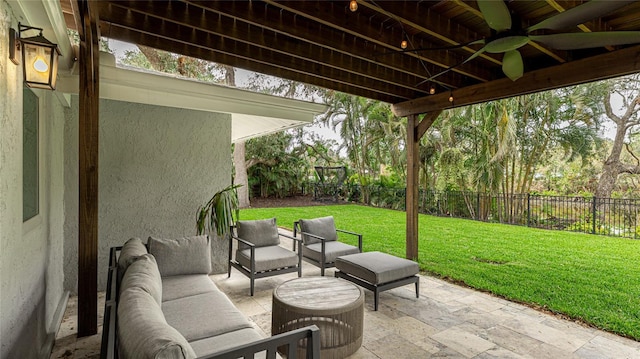 view of patio featuring a fenced backyard, outdoor lounge area, and a ceiling fan