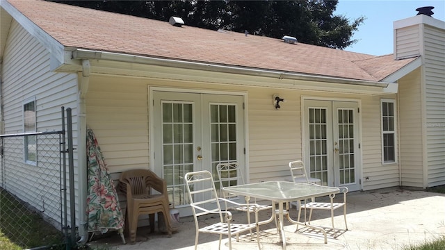 rear view of property with a patio area and french doors