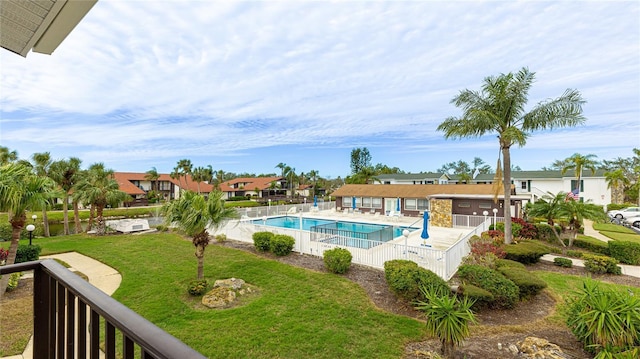 view of pool featuring a lawn and a patio area