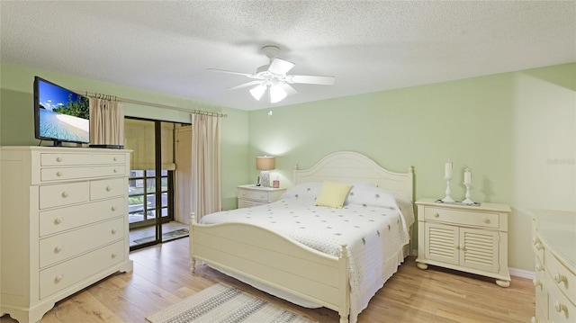 bedroom with access to outside, ceiling fan, a textured ceiling, and light wood-type flooring