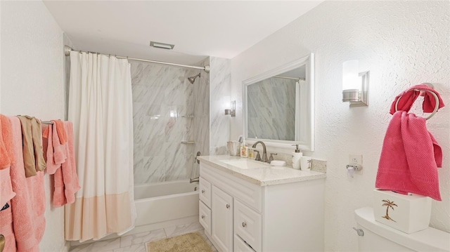 full bathroom featuring vanity, shower / bath combination with curtain, and toilet