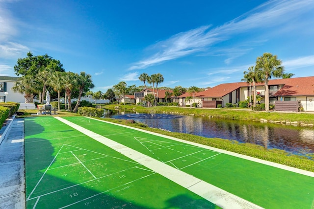 surrounding community featuring a water view