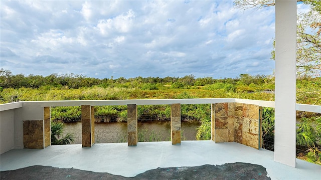 balcony featuring a water view