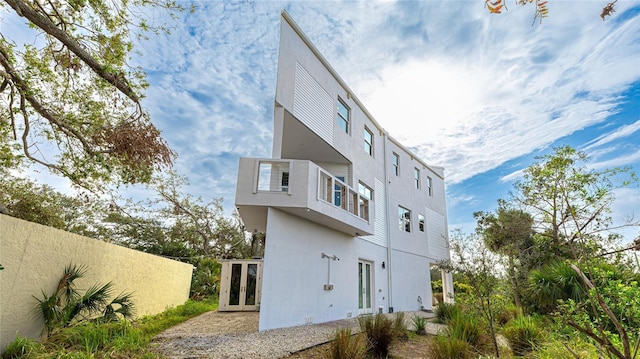 rear view of property featuring french doors