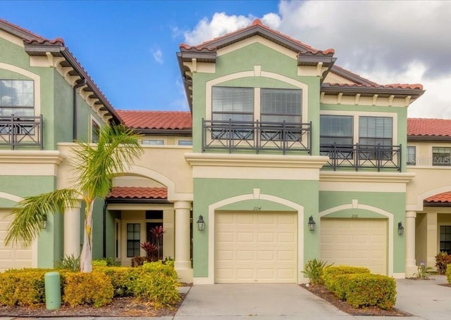 mediterranean / spanish-style home featuring a garage