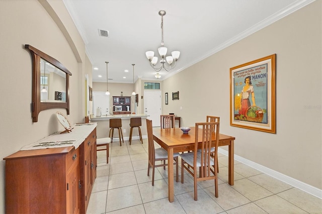 tiled dining area with ornamental molding and a chandelier