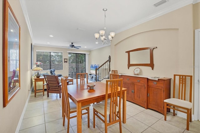 dining space featuring ceiling fan with notable chandelier, light tile patterned flooring, and ornamental molding