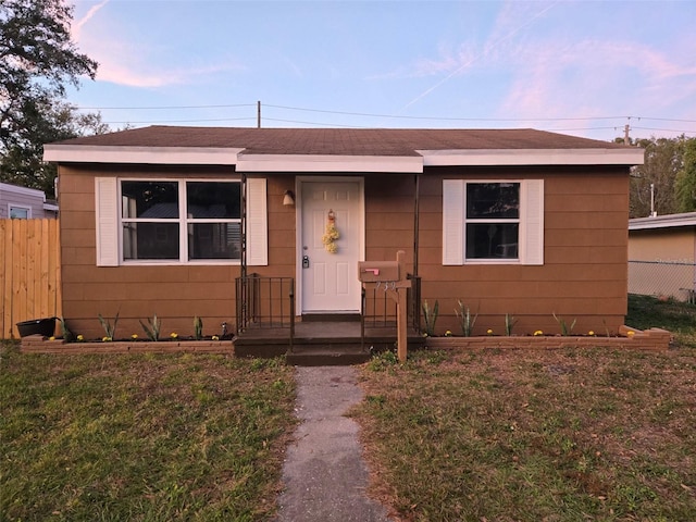 view of front of home with a yard