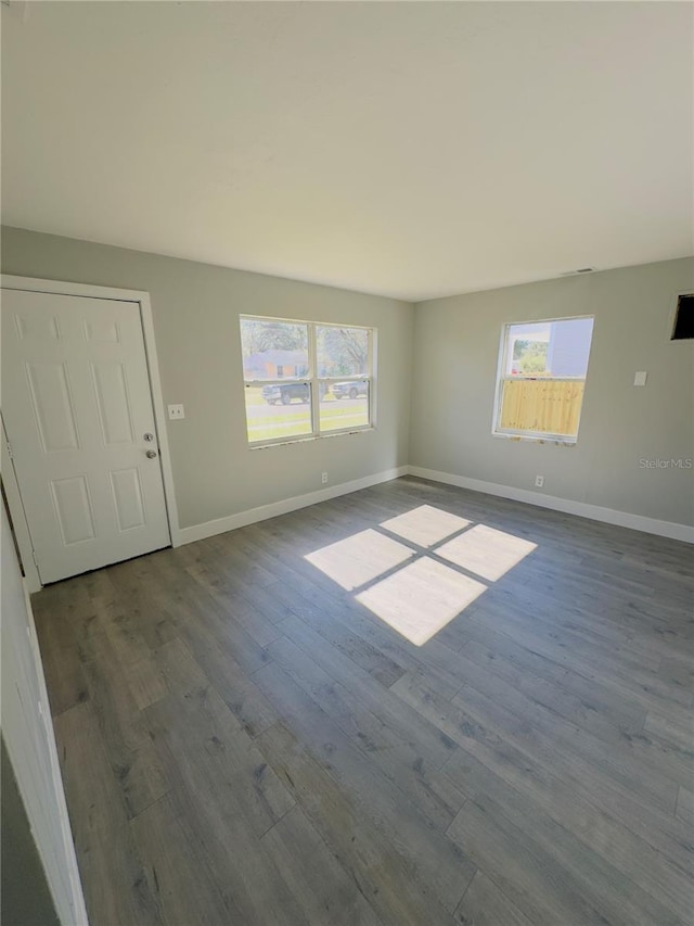 interior space with a healthy amount of sunlight and hardwood / wood-style flooring