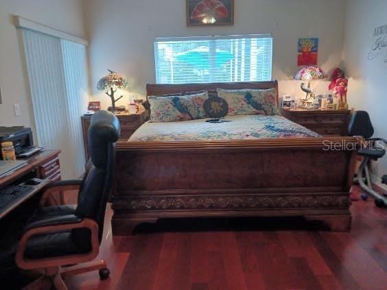 bedroom with hardwood / wood-style floors