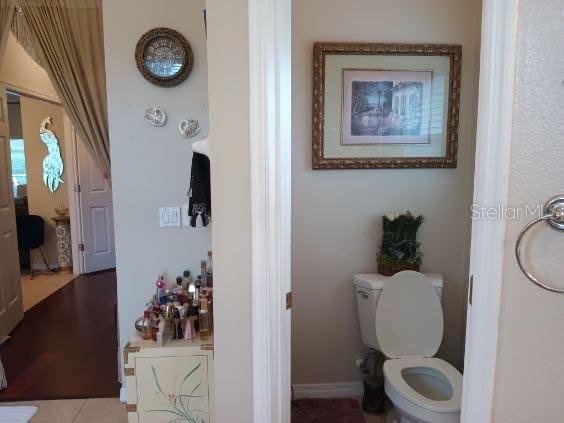 bathroom with tile patterned flooring and toilet