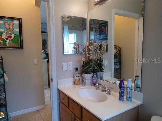 bathroom featuring vanity and tile patterned floors