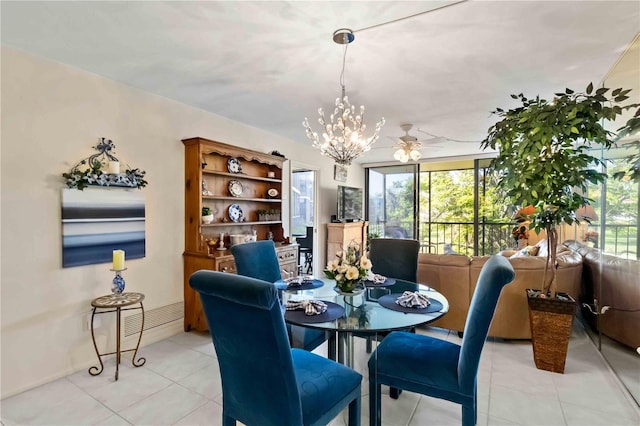 tiled dining area with ceiling fan with notable chandelier