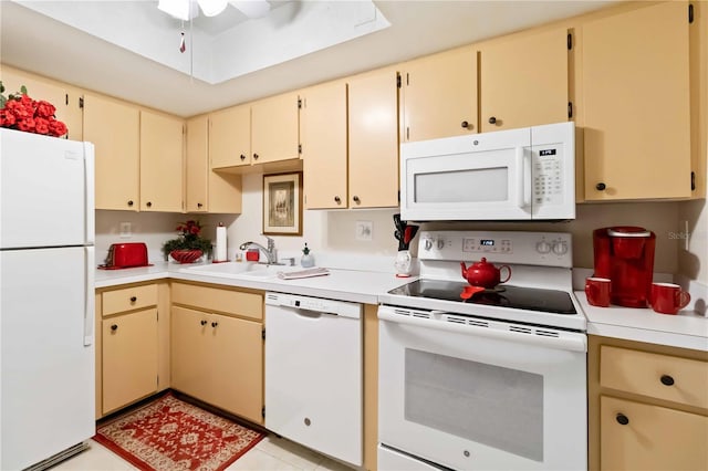 kitchen featuring ceiling fan, white appliances, sink, and light tile patterned floors