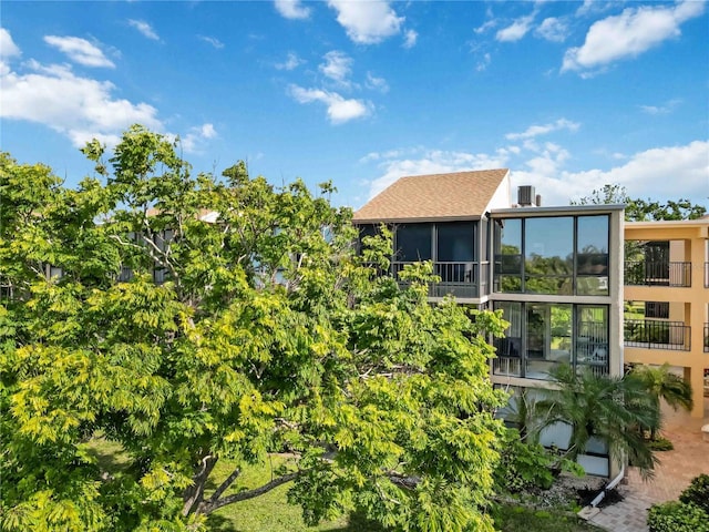 back of house featuring a sunroom