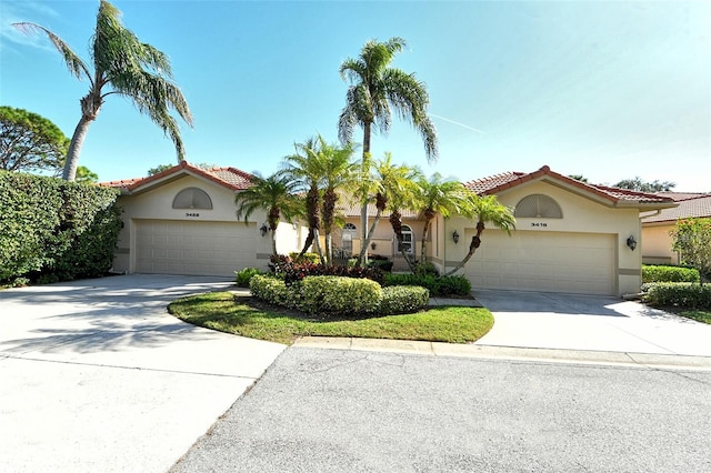 mediterranean / spanish-style house featuring a garage