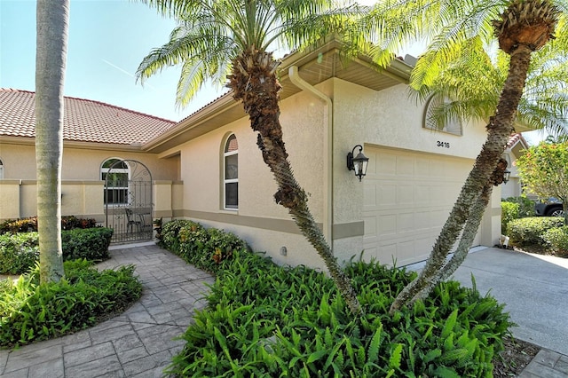 view of property exterior with a garage