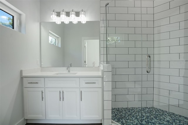 bathroom with vanity and an enclosed shower