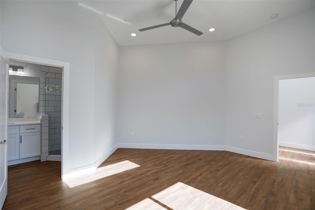 empty room with ceiling fan and dark wood-type flooring