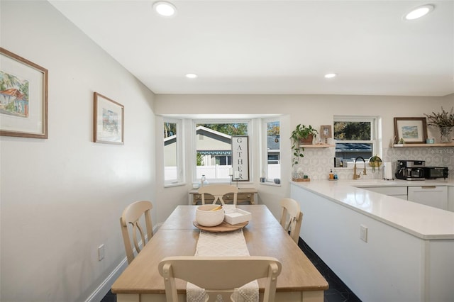 dining area with sink and plenty of natural light