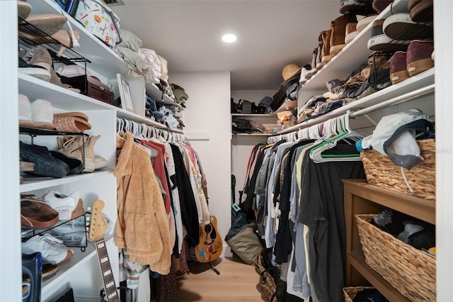 walk in closet featuring light hardwood / wood-style floors